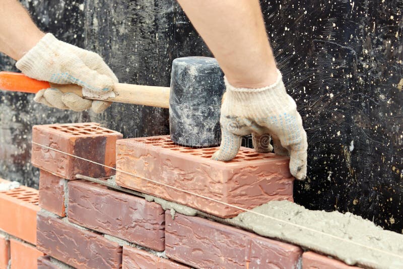Construction of a Brick Wall. Brick Laying. Selective Focus Stock Photo