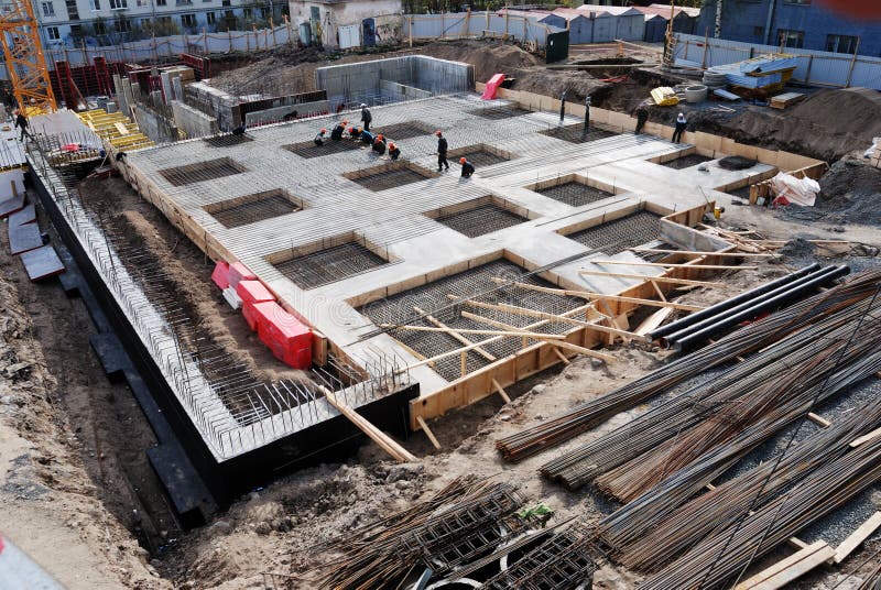 Construction of concrete foundation of building stock photo