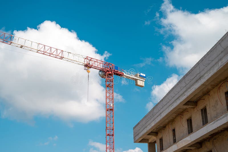 Construction Crane Working on Large Construction Site Stock Image