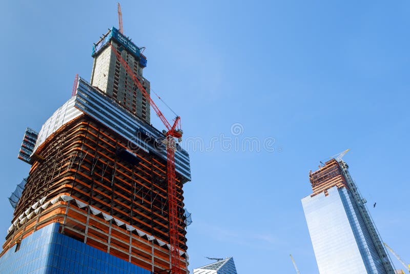 Construction cranes on construction site build office skyscraper building in New York City at sunset time. royalty free stock images Construction cranes on construction site build office skyscraper building in New York City at sunset time. royalty free stock images