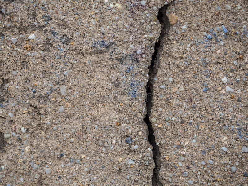Construction Damage in a Wall Cracks in the Concrete Stock Photo