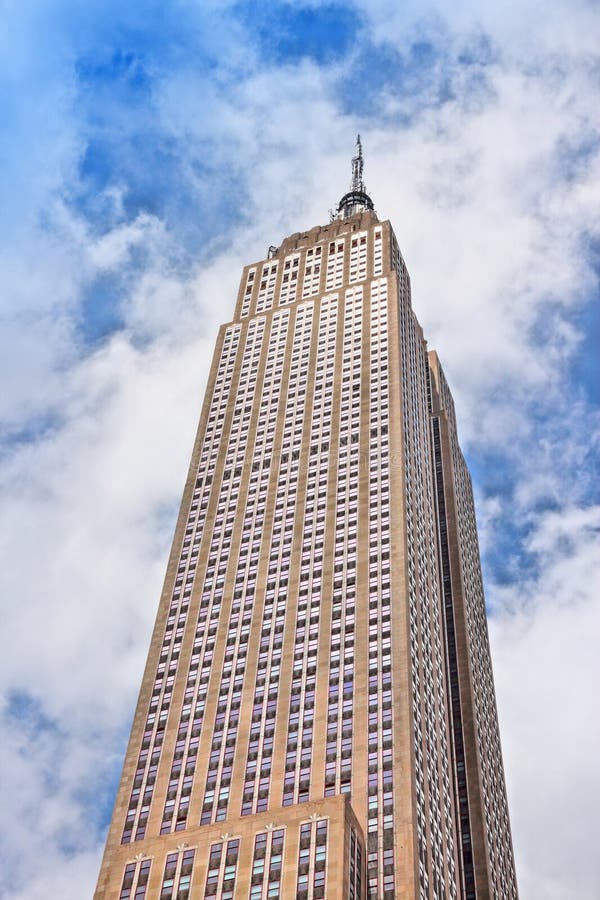 NEW YORK, USA - JULY 4, 2013: Empire State Building  in New York City. The art-deco style 381m tall office building was the tallest building in the world for 40 years. NEW YORK, USA - JULY 4, 2013: Empire State Building  in New York City. The art-deco style 381m tall office building was the tallest building in the world for 40 years