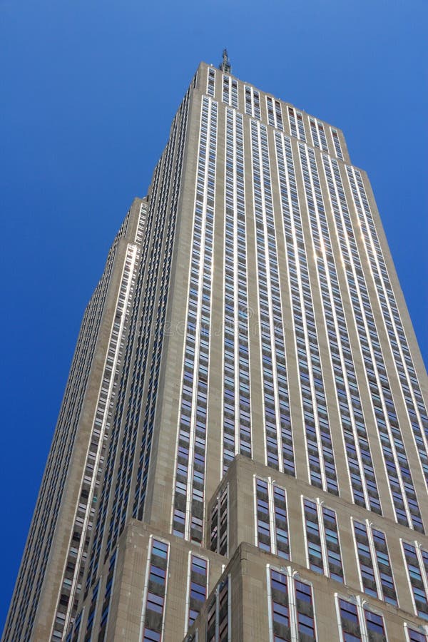 NEW YORK, USA - JULY 4, 2013: Empire State Building  in New York City. The art-deco style 381m tall office building was the tallest building in the world for 40 years. NEW YORK, USA - JULY 4, 2013: Empire State Building  in New York City. The art-deco style 381m tall office building was the tallest building in the world for 40 years