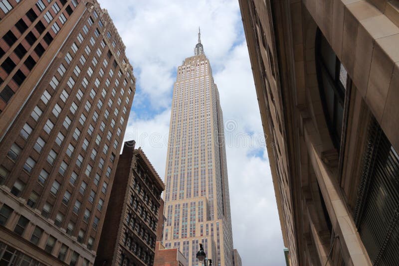 NEW YORK, USA - JULY 4, 2013: Empire State Building skyscraper in New York. The art-deco style 381m tall office building was the tallest building in the world for 40 years. NEW YORK, USA - JULY 4, 2013: Empire State Building skyscraper in New York. The art-deco style 381m tall office building was the tallest building in the world for 40 years