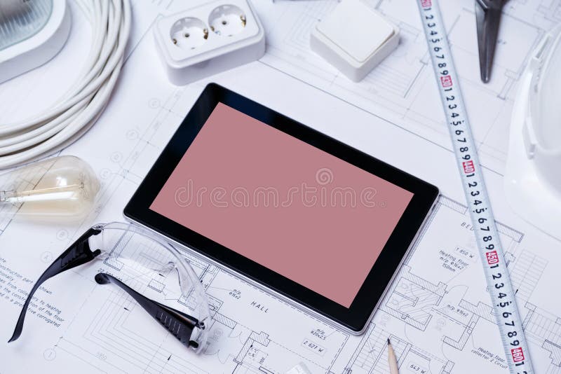 Construction Drawing with Tools and Tablet with Blank Screen Stock
