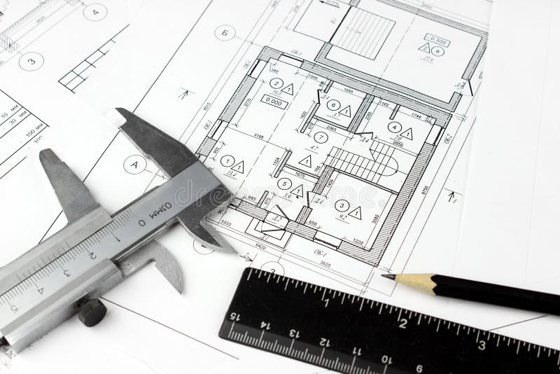 Construction drawings and plan tools. Close-up of Architect engineer drawing plan stock photo