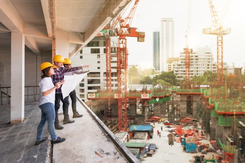 3 construction engineers working together in construction site d stock photography