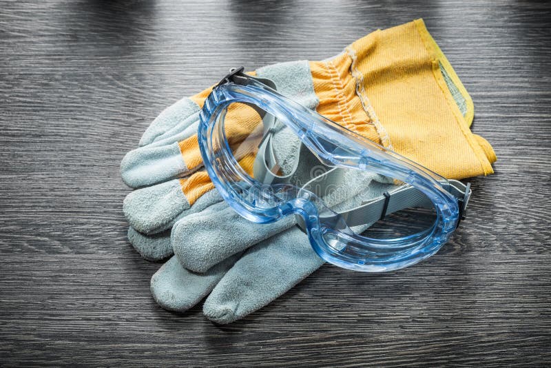 Protective Gloves Safety Glasses on Wooden Board Stock Image Image of