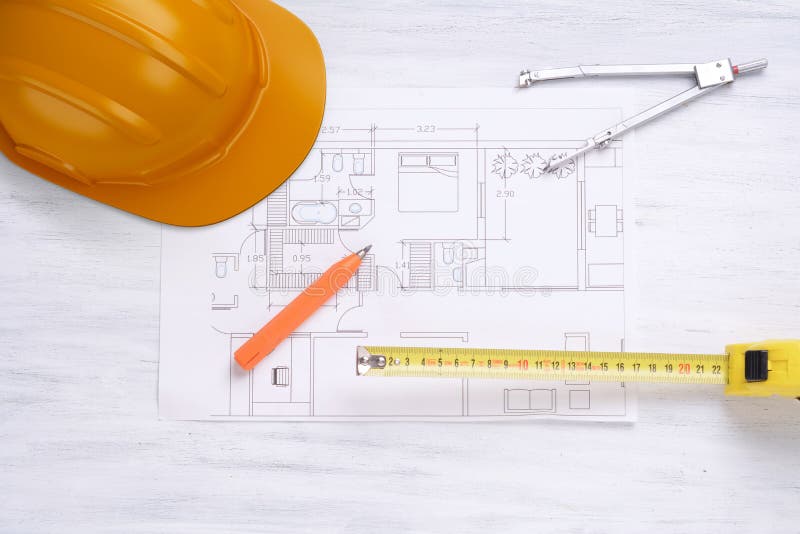 Construction helmet, house plan and tools. stock image Construction helmet, house plan and tools. stock image