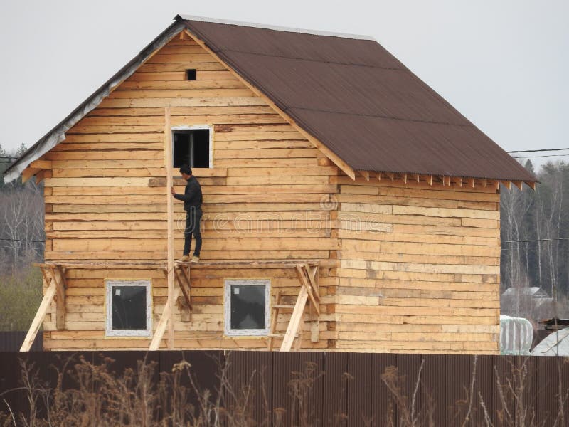 Construction of a house made of laminated veneer lumber. The frame of the house. Cottage made of laminated wood. Erection of the royalty free stock image Construction of a house made of laminated veneer lumber. The frame of the house. Cottage made of laminated wood. Erection of the royalty free stock image