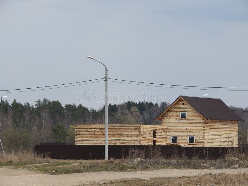 Construction of a house made of laminated veneer lumber. The frame of the house. Cottage made of laminated wood. Erection of the stock photography Construction of a house made of laminated veneer lumber. The frame of the house. Cottage made of laminated wood. Erection of the stock photography