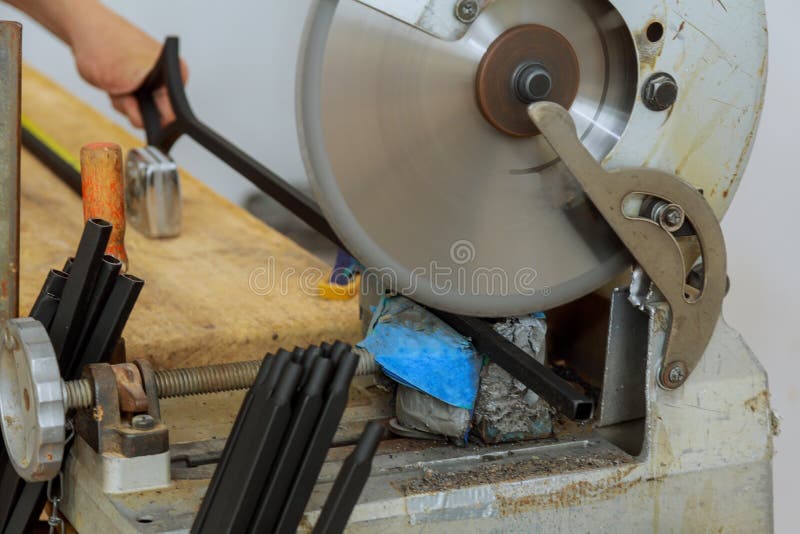 Construction Industry Worker with Electro Saw Cutting and Installing Metal Railings Stock Image