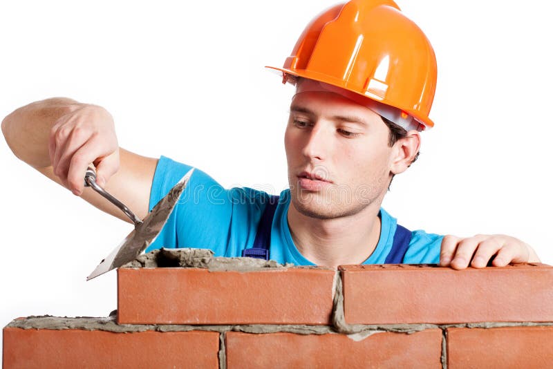 Construction mason installing red brick stock images Construction mason installing red brick stock images
