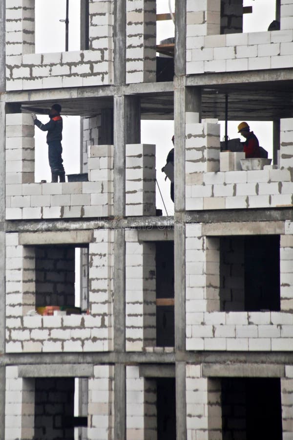 Construction of a New House with a Builders Stock Photo Image of