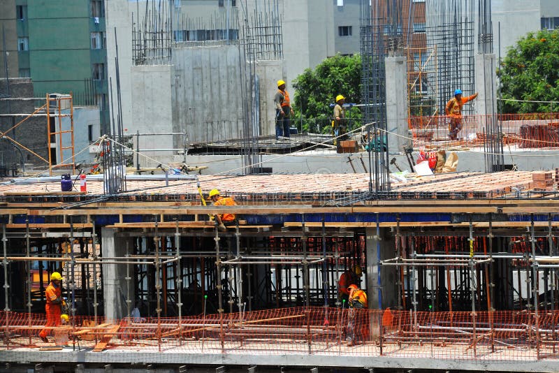 Construction of Office and Apartment Buildings with Engineer Workers Working on Floor and