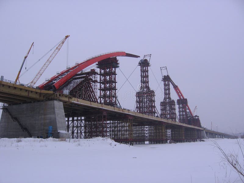 Construction in progress arch bugrinskij bridge in Novosibirsk engineering construction in winter royalty free stock image Construction in progress arch bugrinskij bridge in Novosibirsk engineering construction in winter royalty free stock image