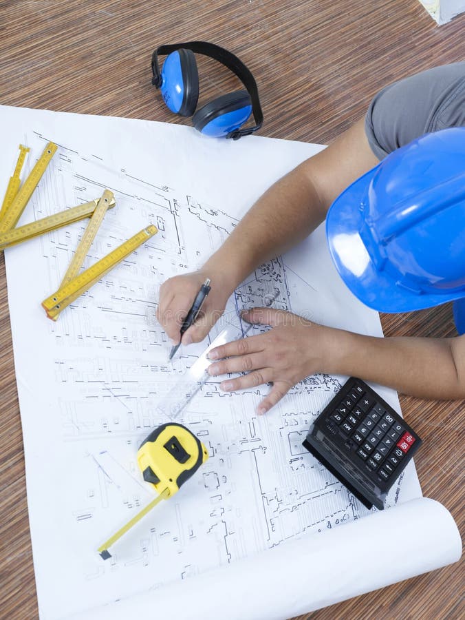 Construction engineer working on blueprints. Architect uniform stock images, royalty-free photos and pictures