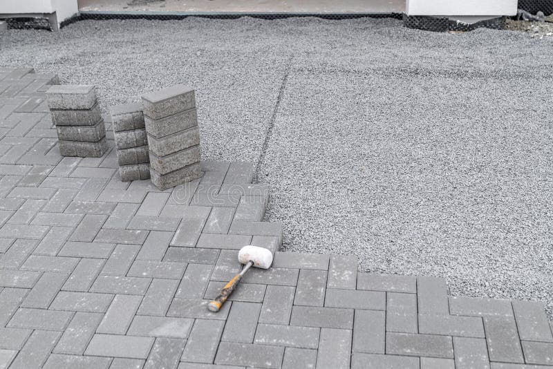 Construction of a Sidewalk Made of Concrete Blocks, Copy Space Stock