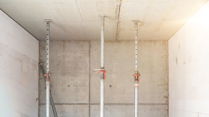 Construction site background - shell construction on a construction site with bare shuttered concrete walls and fallen ceiling stock photos