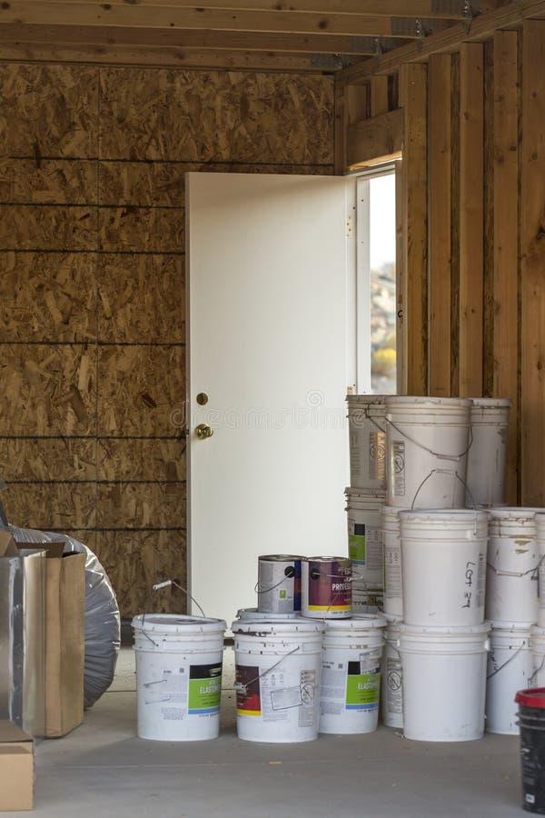 Construction Site Buckets of Paint and Rolls of Materials Inside an