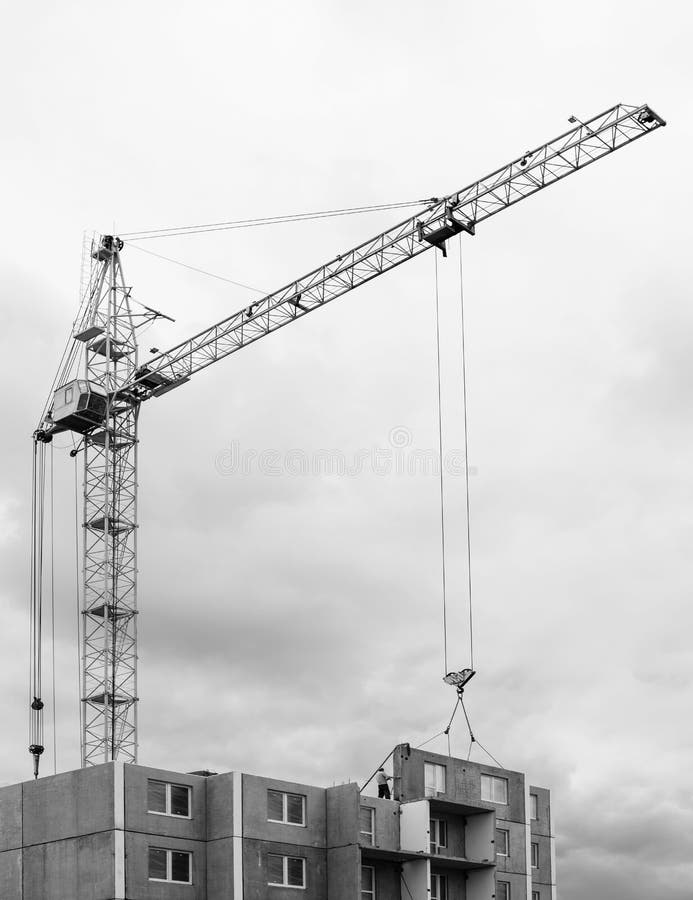 Construction site. Construction cranes and apartment building un stock image