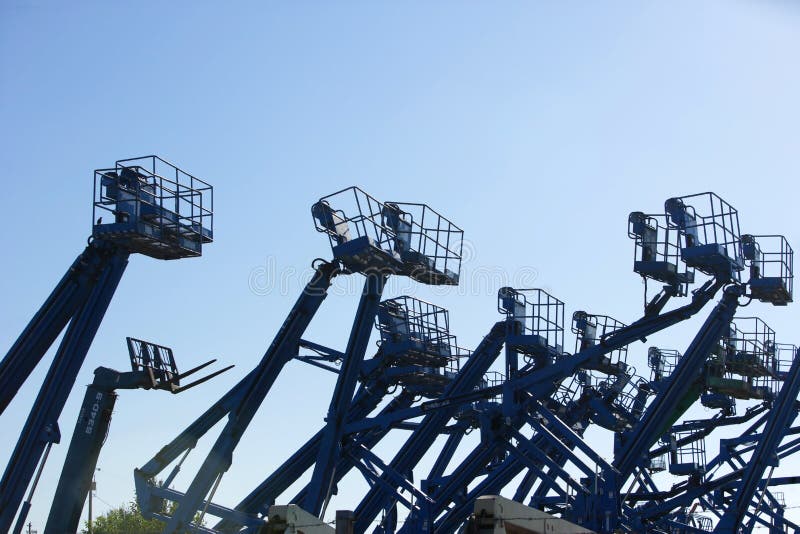 A construction site filled with lifts