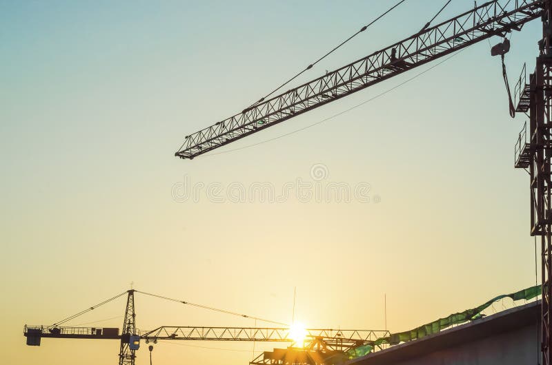 Construction site with sunrise.