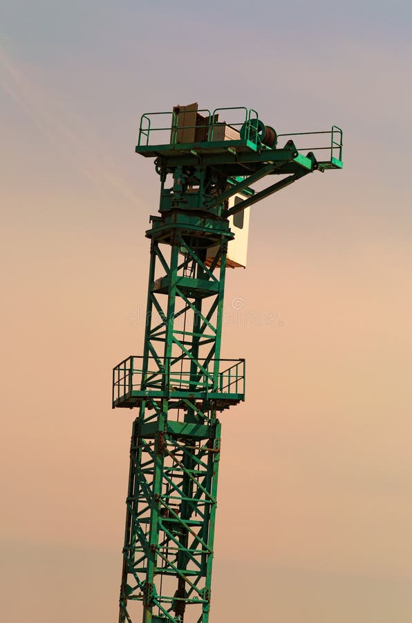 The construction site. Tower crane installation process. Against the sky, close up view