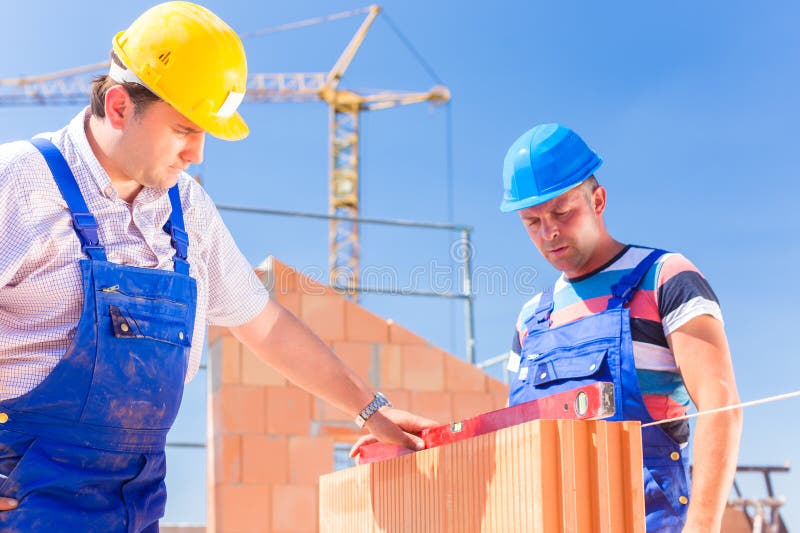 Construction Site Workers Checking Building Shell Stock Image Image