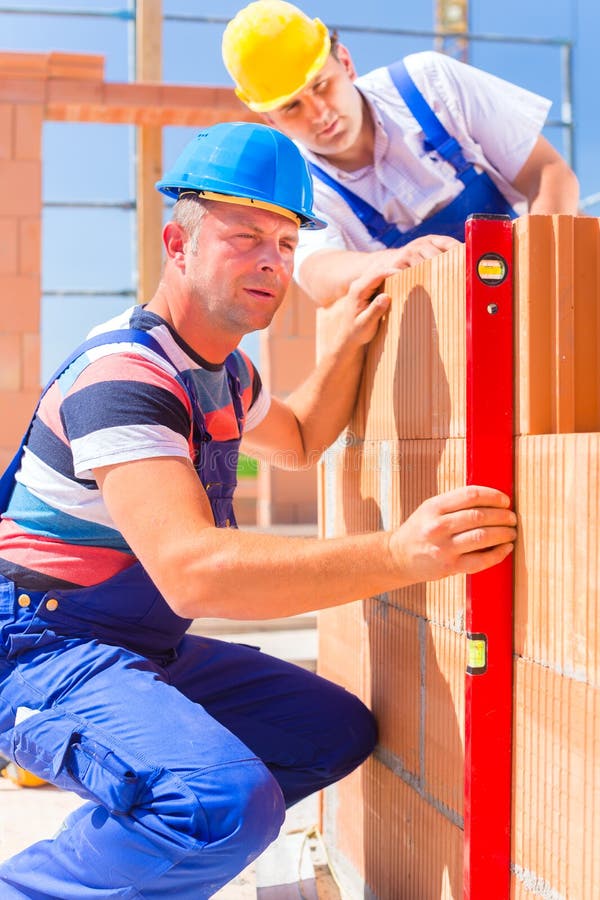 Construction Site Workers Checking Building Shell Stock Image Image