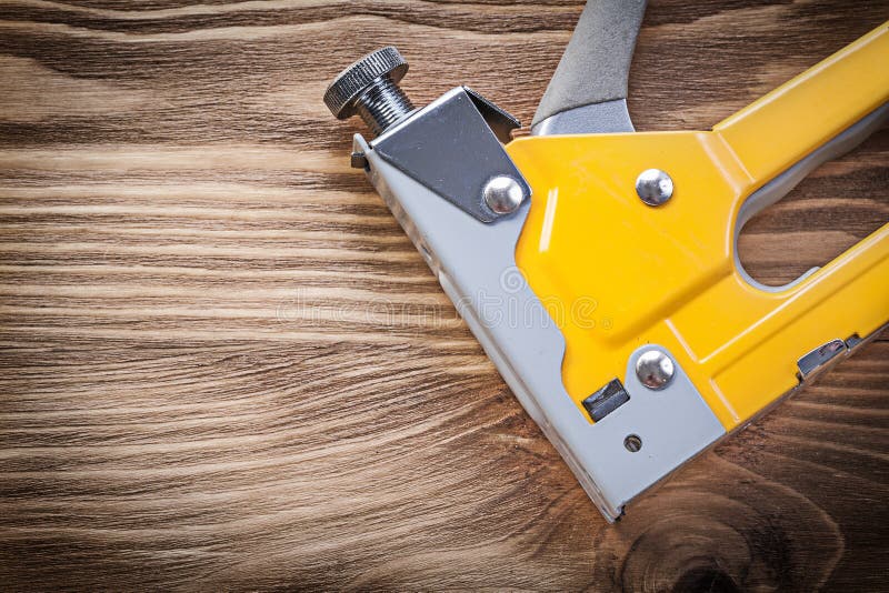 Construction Stapler on Wooden Board Maintenance Concept Stock Image