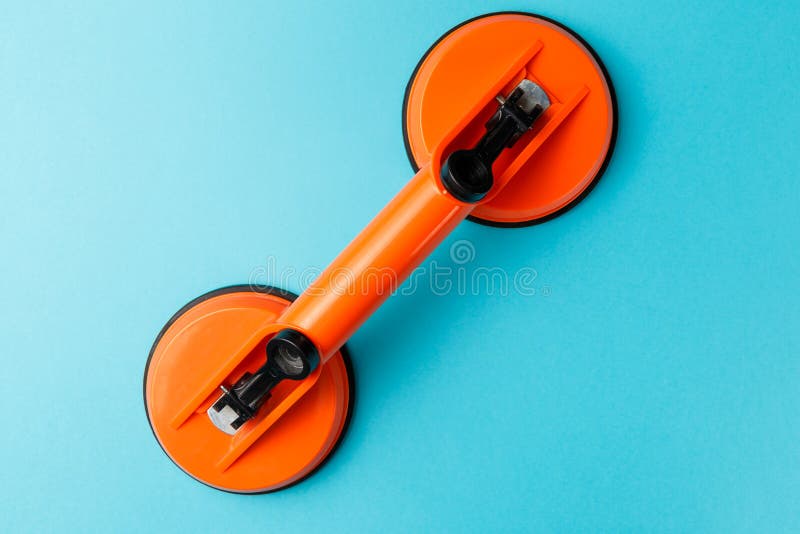 Construction suction cup isolated on blue backgrounds. Professional tool. Top view stock images