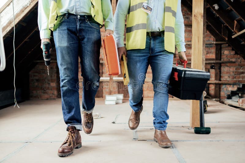 Construction, Team and Legs of Engineers Walking on the Building Site