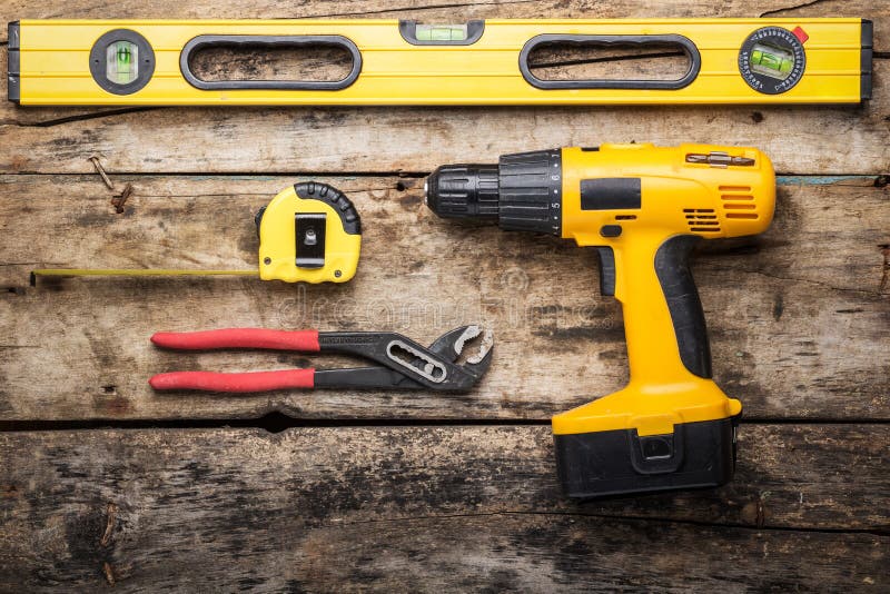 Construction Tools on Wooden Background Stock Photo Image of golden