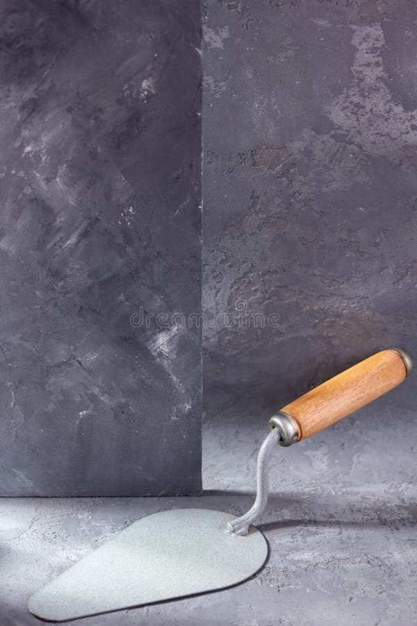 Construction Trowel Tool on Cement Background. Mason Tools on Concrete Wall Stock Photo Image