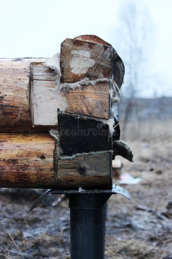 Construction of a Wooden House on a Pile Foundation. Stock Photo