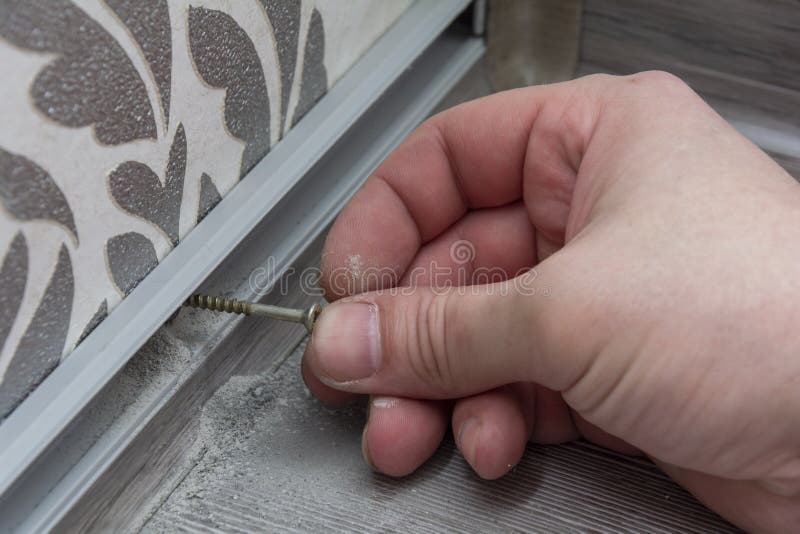 Installation of Floor Plastic Skirting Boards. Stock Image Image of