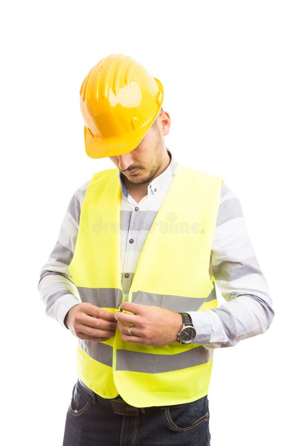 Construction worker or builder dressing for job stock photography Construction worker or builder dressing for job stock photography