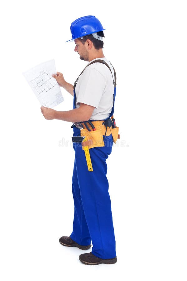 Construction worker checking the blueprints stock photography
