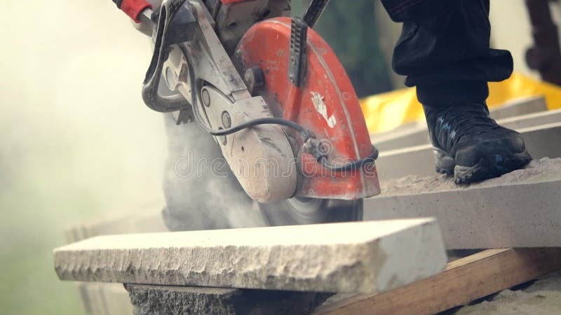 Construction Worker Cutting Stone