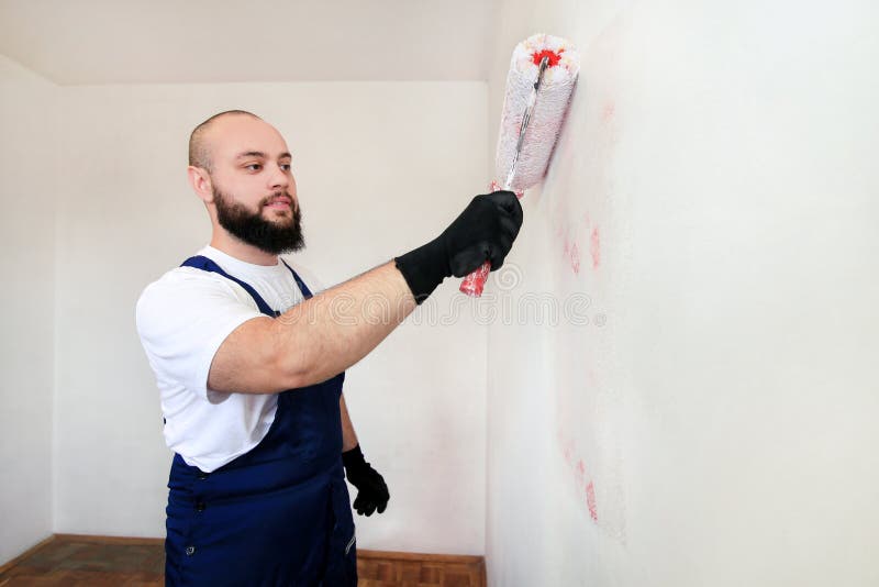 Construction Worker Doing Finish Renovation at Apartment. Painter Contractor Using White Paint