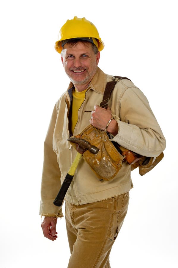 Construction worker in a hardhat with tools. stock image