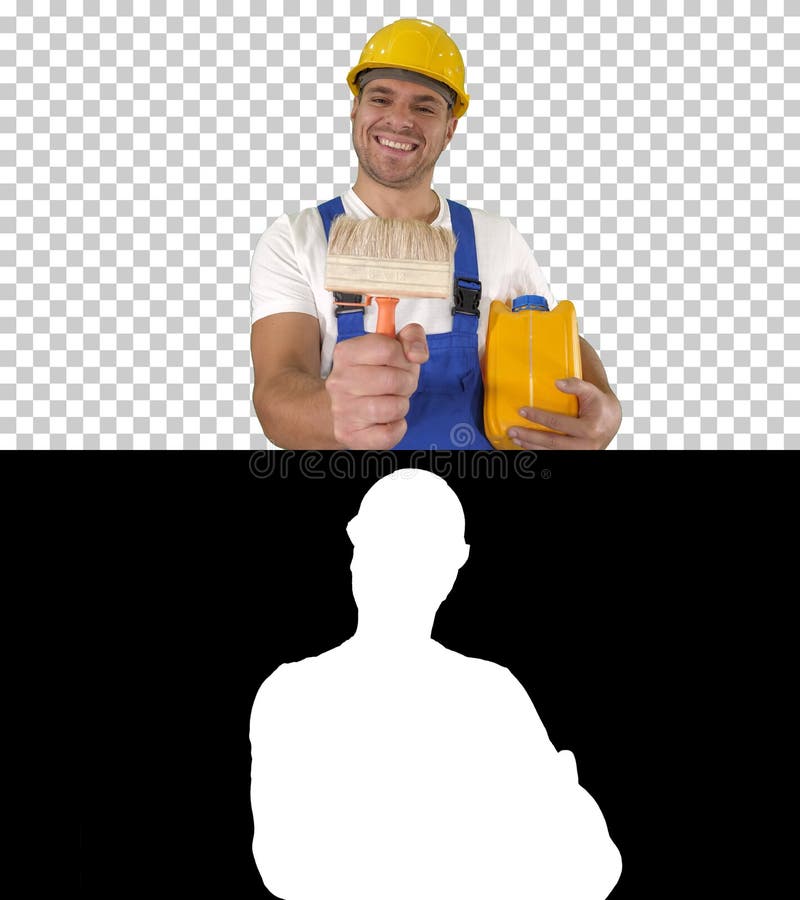 Construction worker painter showing paint brush to camera and sm stock photos