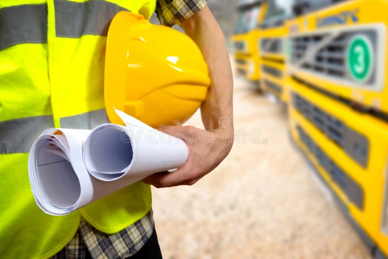 Close up of a construction worker's hand holding project documents and helmet. Architect uniform stock images, royalty-free photos and pictures
