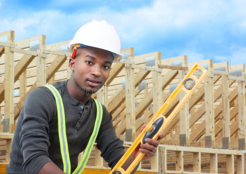 Construction site worker with level helmet and beams background. Construction site worker with level helmet and beams background