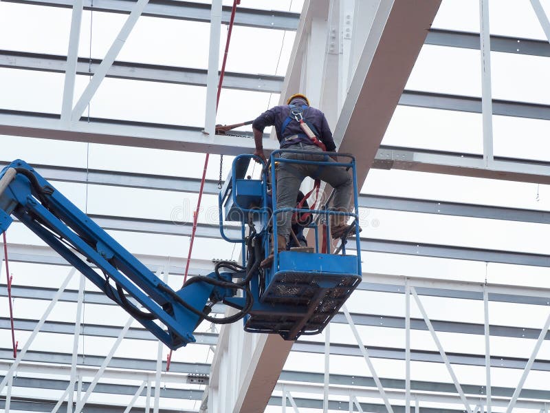 Man Working on the Working at Height on Construction Editorial Photo