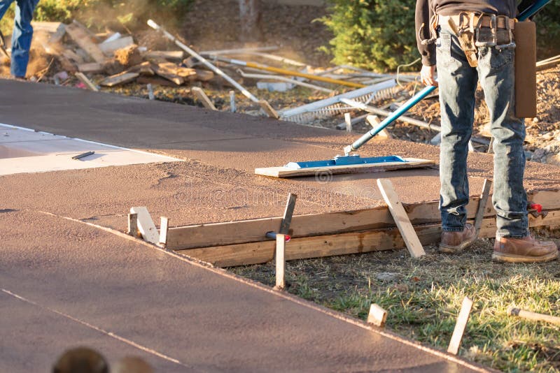 Construction Worker Smoothing Wet Cement with Trowel Tool Stock Image