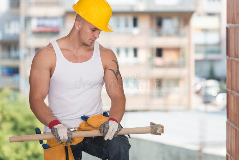 Construction Worker Relaxing The Fresh Air During Work.