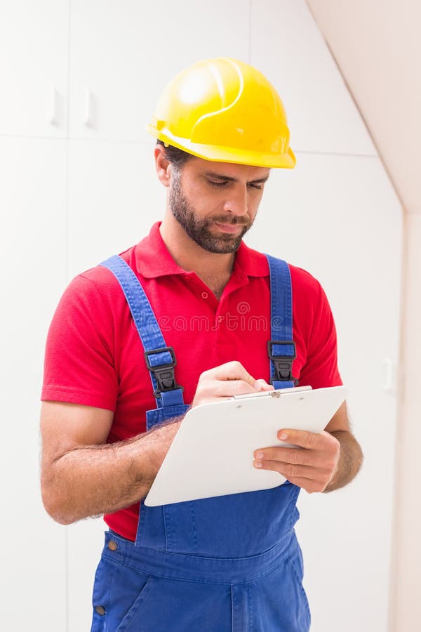 Construction Worker Taking Notes on Clipboard Stock Photo Image of