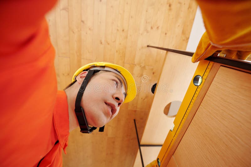 Construction Worker Installing Wooden Shelves Stock Image Image of